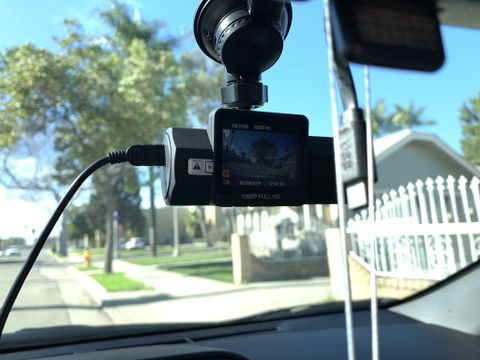 A dash cam in operation in a car