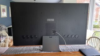 Samsung QN900C rear on a table, showing the speaker array