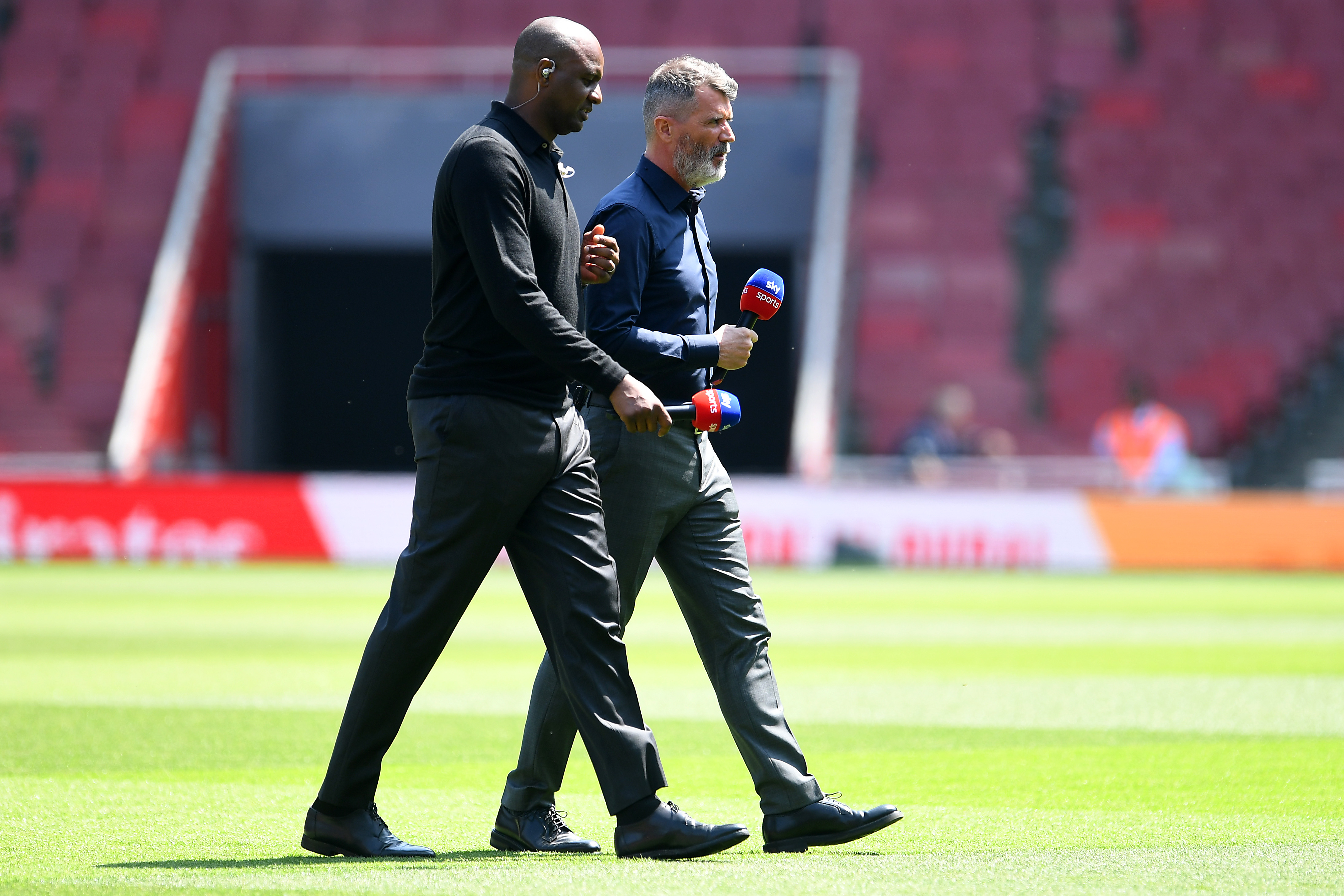 LONDON, ENGLAND - MAY 14: Sky Sports Pundits Patrick Vieira and Roy Keane talk prior to the Premier League match between Arsenal FC and Brighton &amp;amp; Hove Albion at Emirates Stadium on May 14