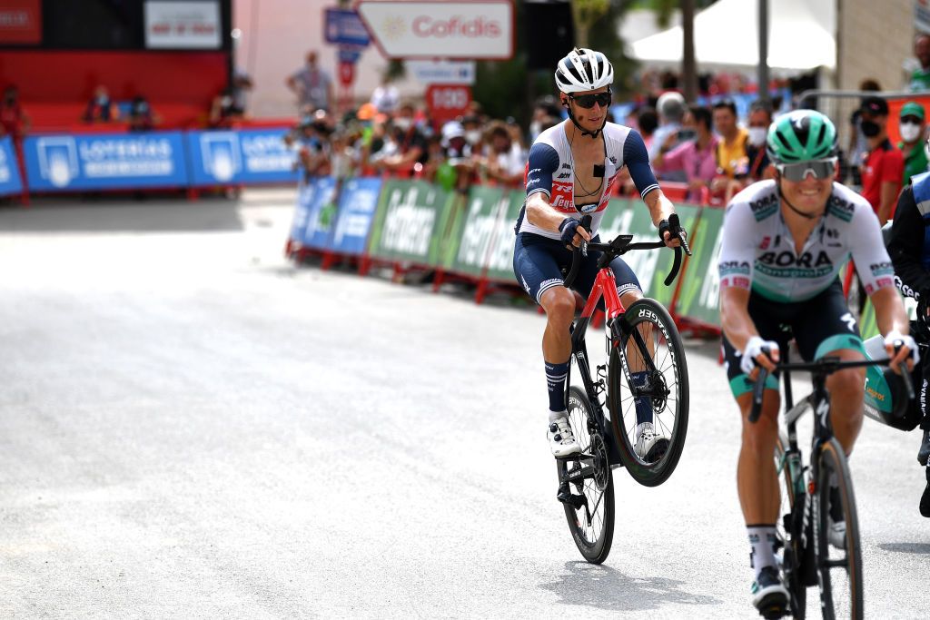 VALDEPEAS DE JAN SPAIN AUGUST 25 Alex Kirsch of Luxembourg and Team Trek Segafredo wheelies at finish line during the 76th Tour of Spain 2021 Stage 11 a 1336km stage from Antequera to Valdepeas de Jan 1009m lavuelta LaVuelta21 on August 25 2021 in Valdepeas de Jan Spain Photo by Stuart FranklinGetty Images