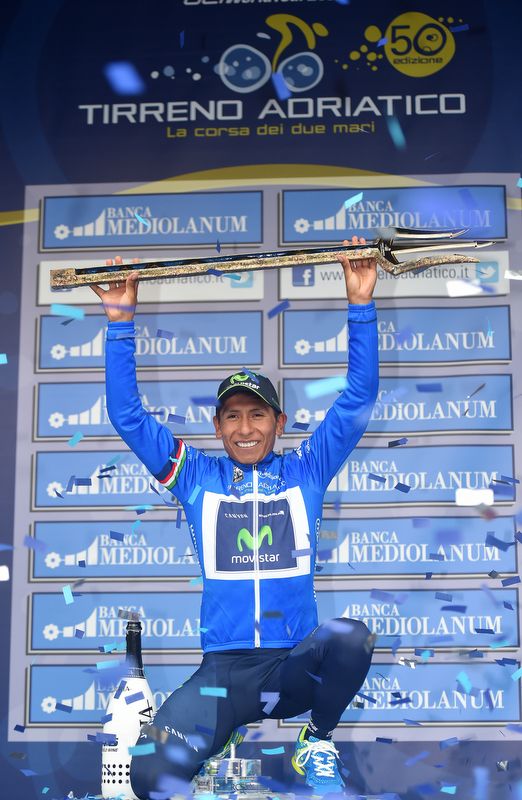 Nairo Quintana (Movistar) hold the trident trophy aloft