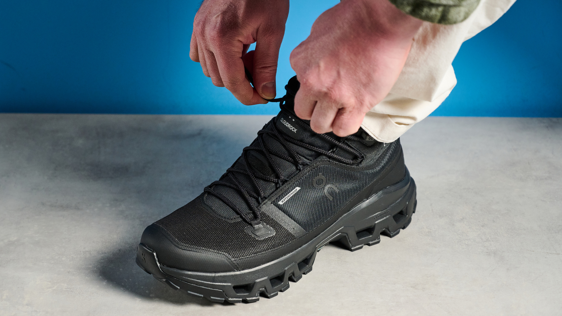 The On Cloudrock Mid WP boots being laced up