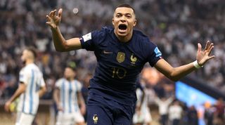 Kylian Mbappé celebrates after scoring his second goal for France against Argentina in the 2022 World Cup final.
