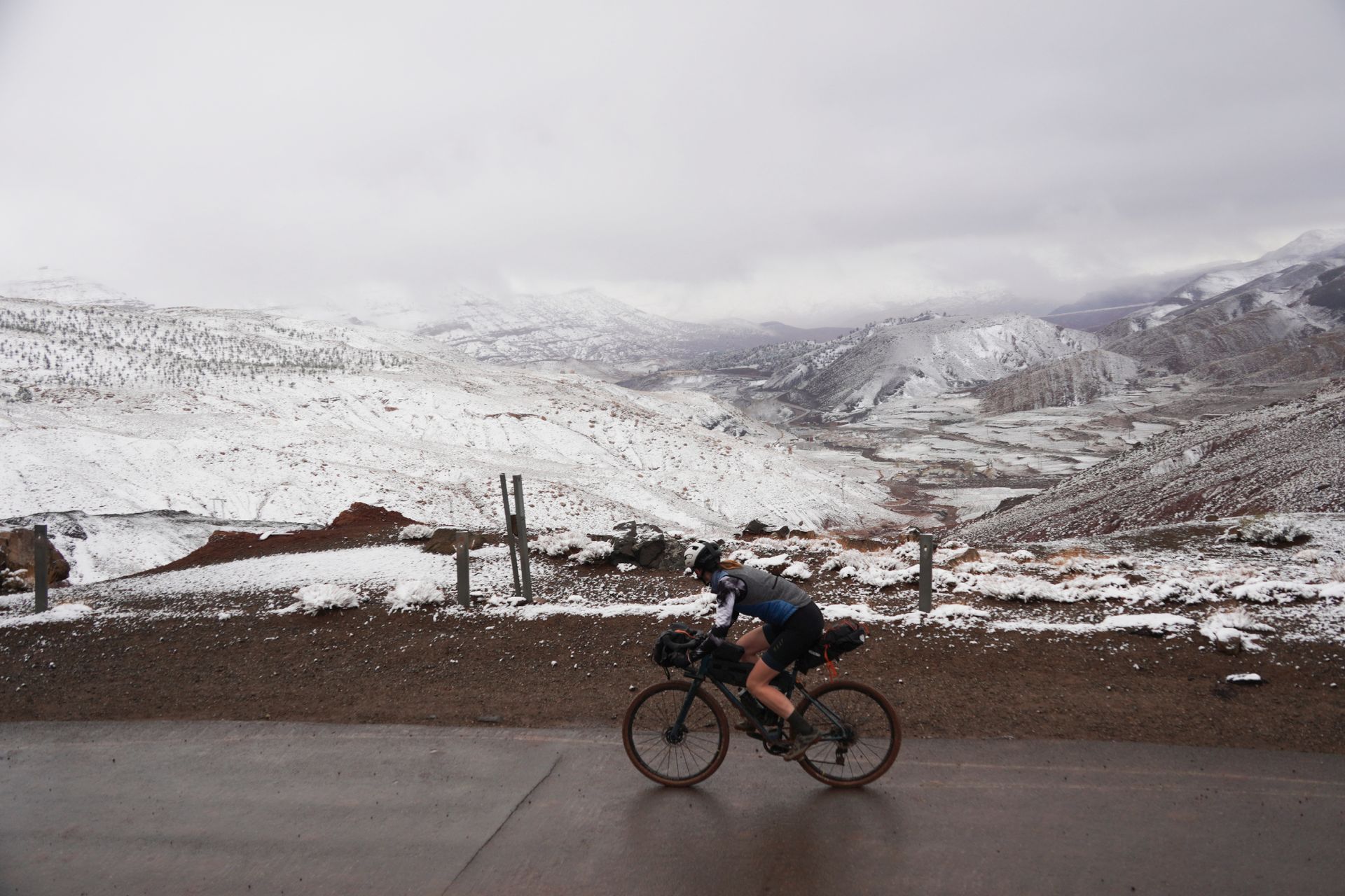 Image shows Anna cycling in the Atlas mountains in Morocco