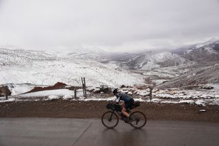 Image shows Anna cycling in the Atlas mountains in Morocco