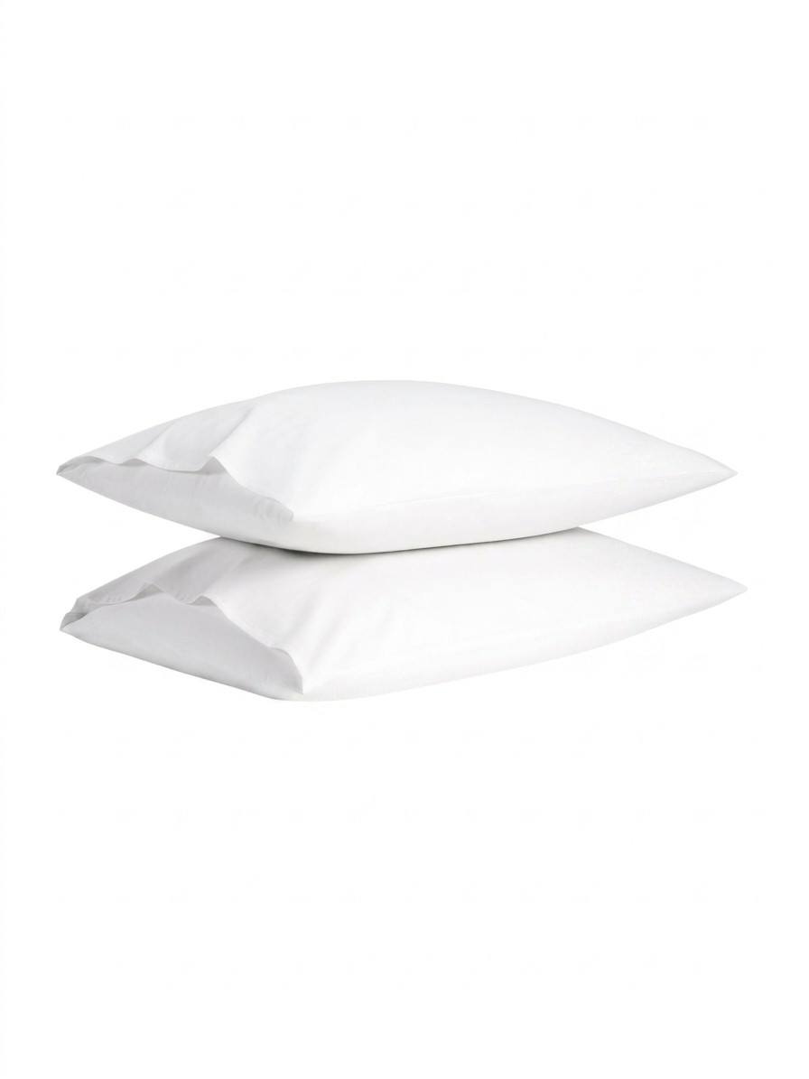 A set of two pillows dressed in Brooklinen Luxe Sateen pillowcases