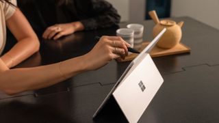 Someone using the Microsoft Surface pen with the Microsoft Surface Pro X
