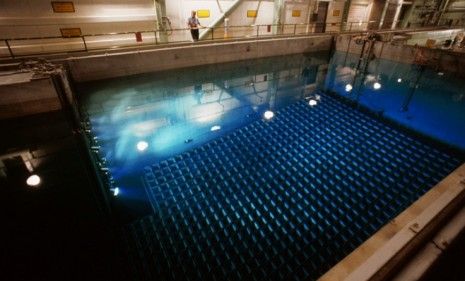 A water-filled tank in Virginia is used to cool and store used-up radioactive fuel rods: Pools like these in the U.S. are holding about four times more than originally intended.