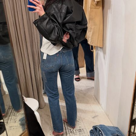 Mimi Nguyen takes a mirror selfie trying on cool Levi's jeans for 2026