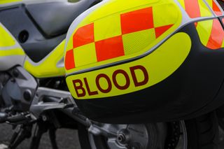 Blood sign on a motorcycle used to transport blood donations