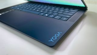 Close up of the "Yoga" logo on the keyboard deck of the Lenovo Yoga Slim 7x