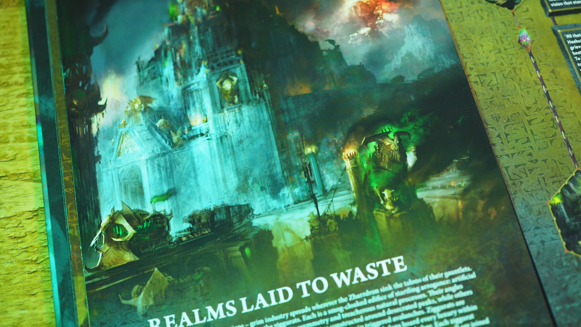 Helsmiths of Hashut Battletome, open on a page with a flaming citadel
