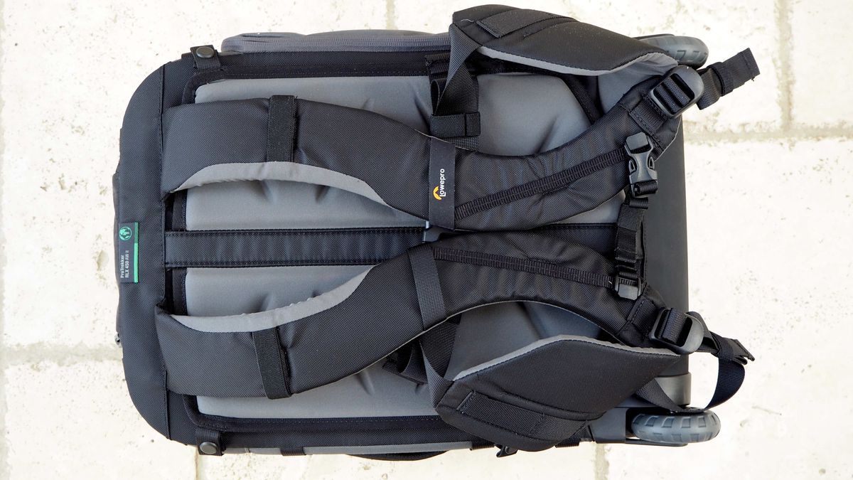 Lowepro Pro Trekker RLX 450 AW II roller backback on a light stone floor