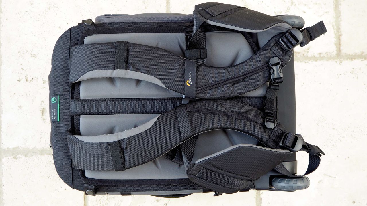 Lowepro Pro Trekker RLX 450 AW II roller backback on a light stone floor