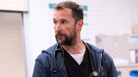 Dr. Robby looks at something offscreen