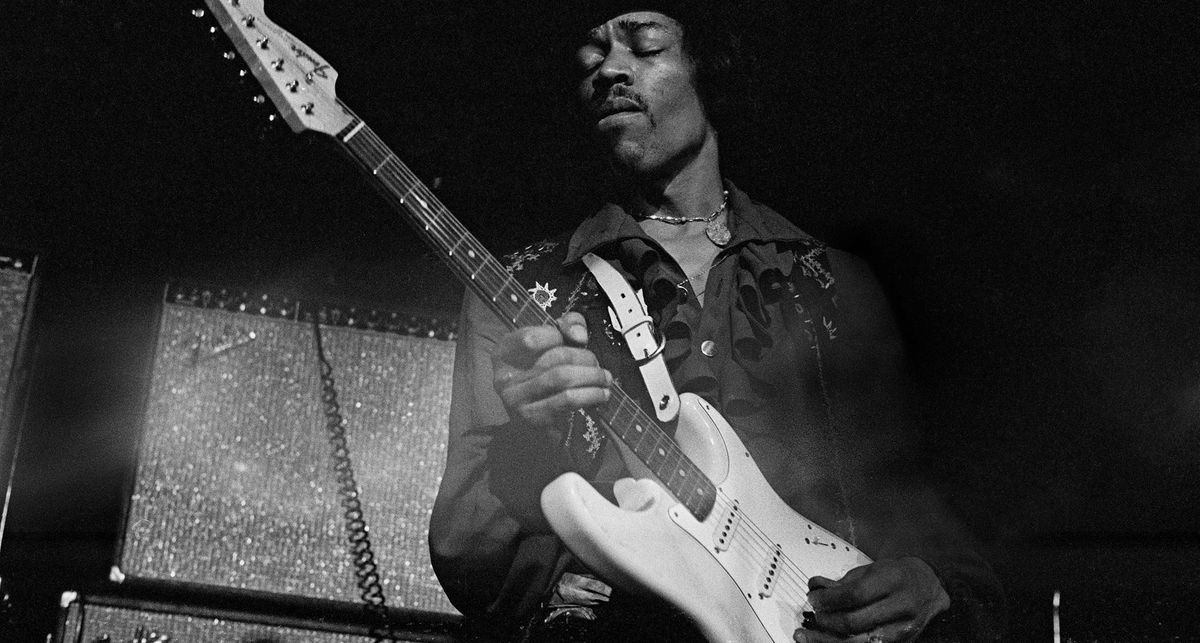 Jimi Hendrix plays his Olympic White Stratocaster in front of a Fender combo in this archive black-and-white photo from 1968.