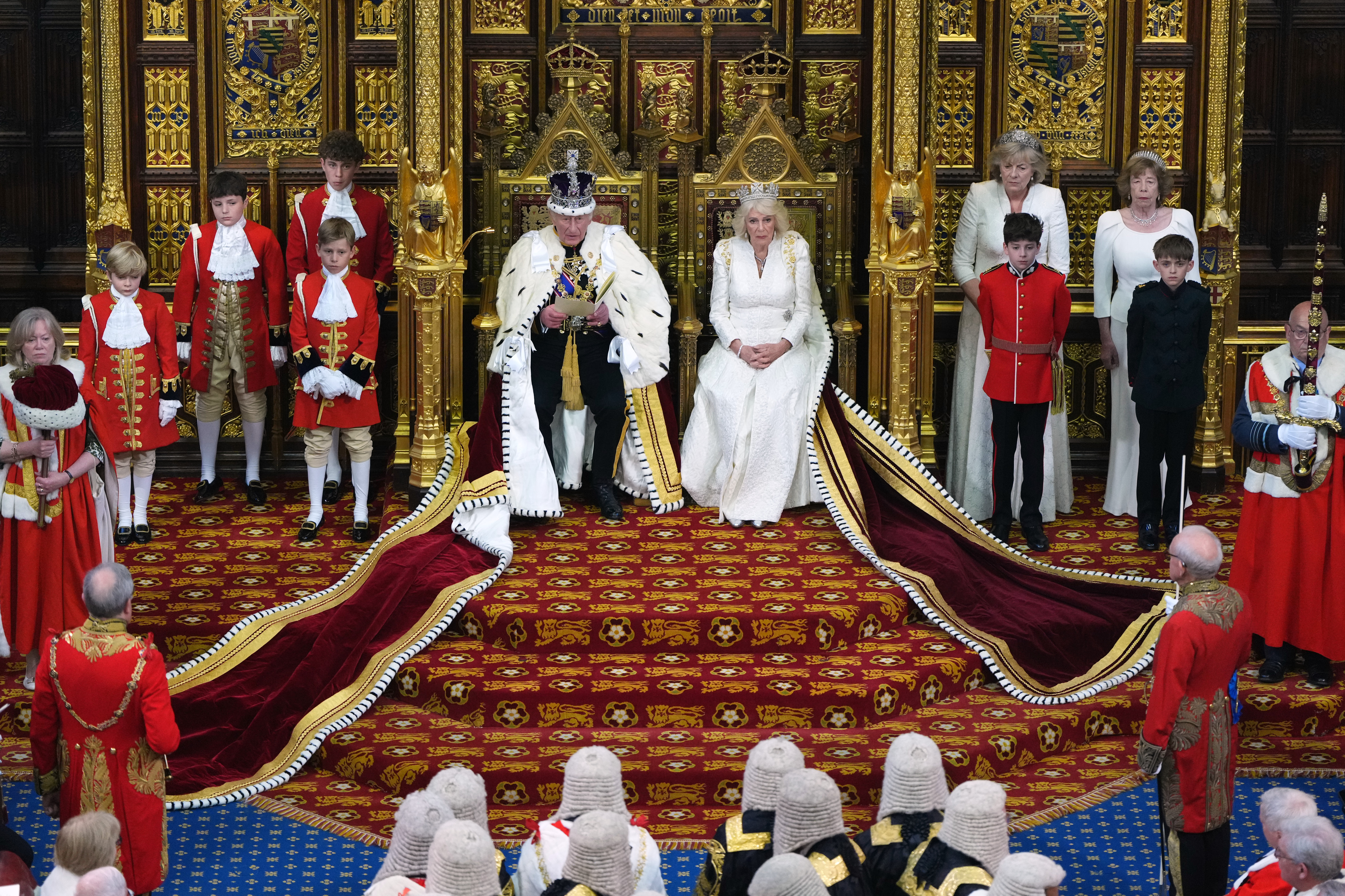 Britain's King Charles III besides Queen Camilla during the State Opening of Parliament at the Palace of Westminster in London, Wednesday, May 13, 2026.(AP Photo/Kirsty Wigglesworth, Pool)