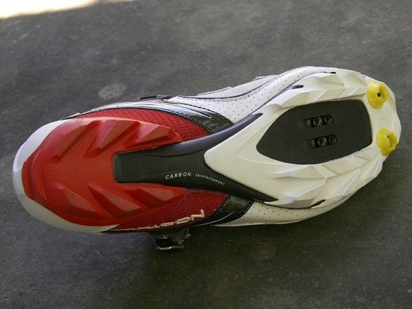The carbon-reinforced nylon sole is notably more flexible than true carbon plates but still reasonably stiff