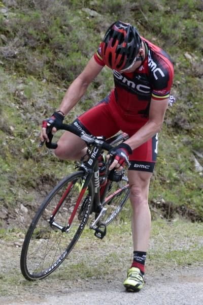 Cadel Evans is delayed with a puncture after saboteurs scattered tacks on the road of stage 14 of the Tour de France