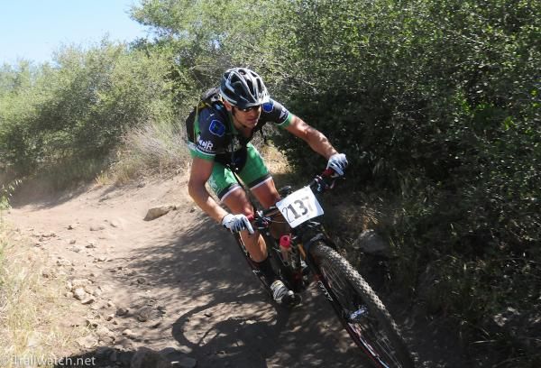 A rider using the berms on the descent