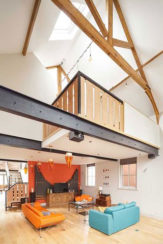 double height space with mezzanine level and exposed beams