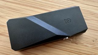 Campfire Audio Rely headphone DAC on a wooden surface