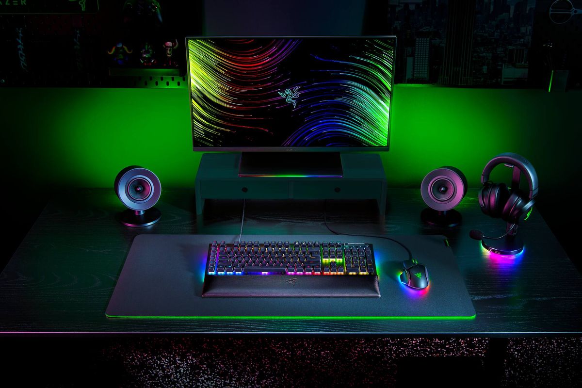 Razer Blackwidow V4 sat in a full Razer desktop setup