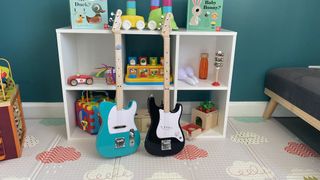 Pair of Fender x Loog guitars in a child's playroom