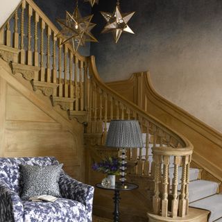 living room with star shape lights at wooden staircase