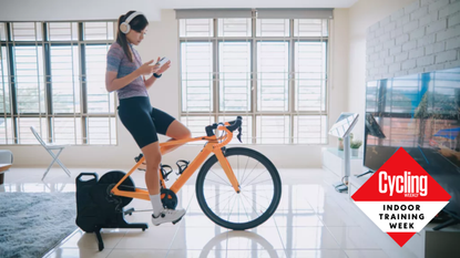 Image shows a rider wearing headphones while cycling indoors.