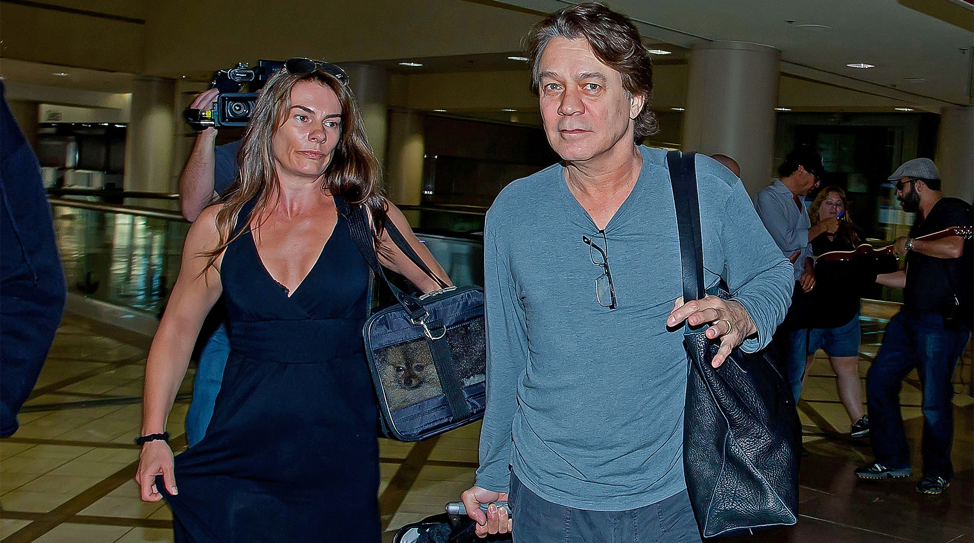 Eddie Van Halen and his wife Janie Liszewski are seen at Los Angeles International Airport on June 27, 2012 in Los Angeles, California. 