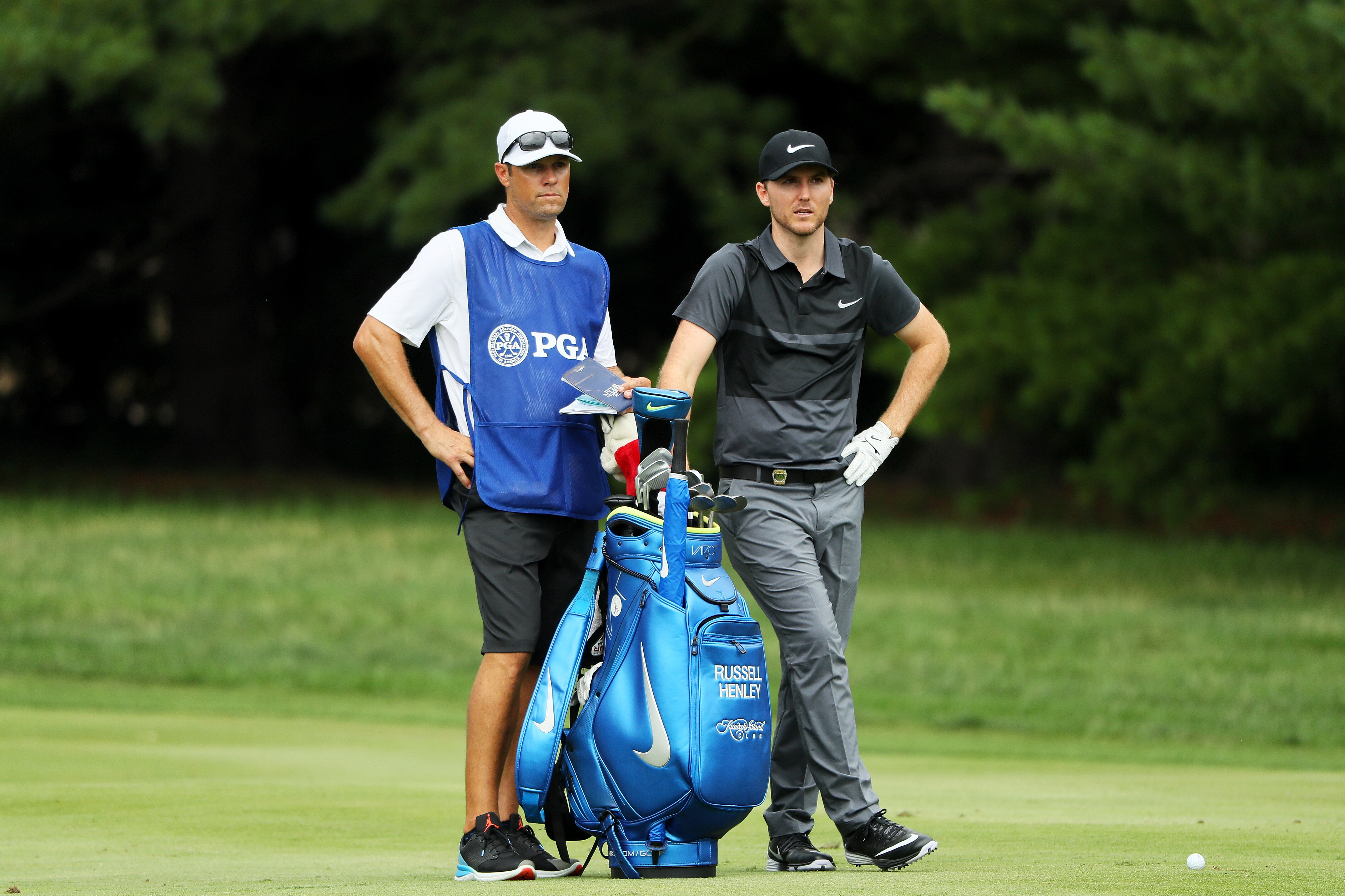 Russell Henley (right) and caddie Adam Hayes look on during the 2016 PGA Championship