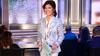 Julie Chen Moonves posing on the Big Brother stage