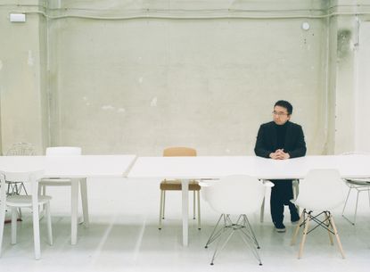 Portrait of japanese architect Sou Fujimoto in his minimalist office in Tokyo