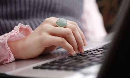 Woman checking laptop