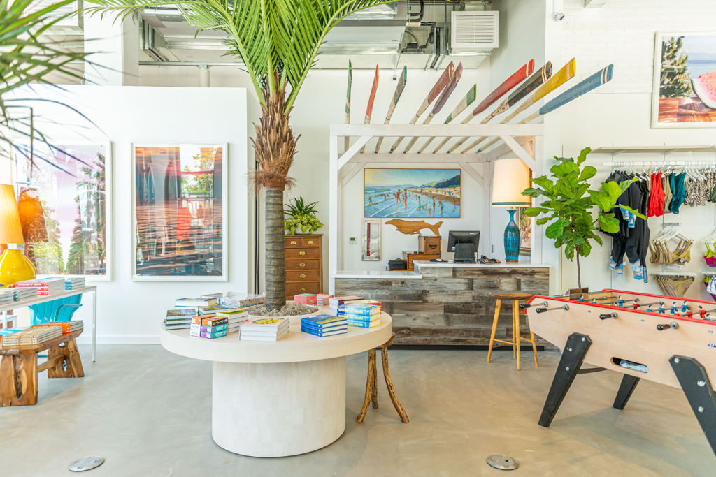 A nostalgic, surf-inspired hotel gift shop features natural light and plenty of colorful collectibles.