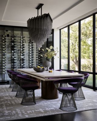 black and gray dining room with purple chairs