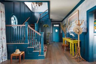 a hallway in jewel tone blue and yellow