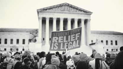 People rally to show support for the Biden administration's student debt relief plan in front of the the Supreme Court of the United States