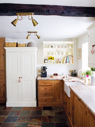 A mix of natural wood and painted furniture in this Yorkshire farmhouse kitchen