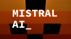 Mistral logo and branding pictured against a multi-colored black, orange, and yellow background.