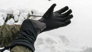Man putting winter gloves on stock photo
