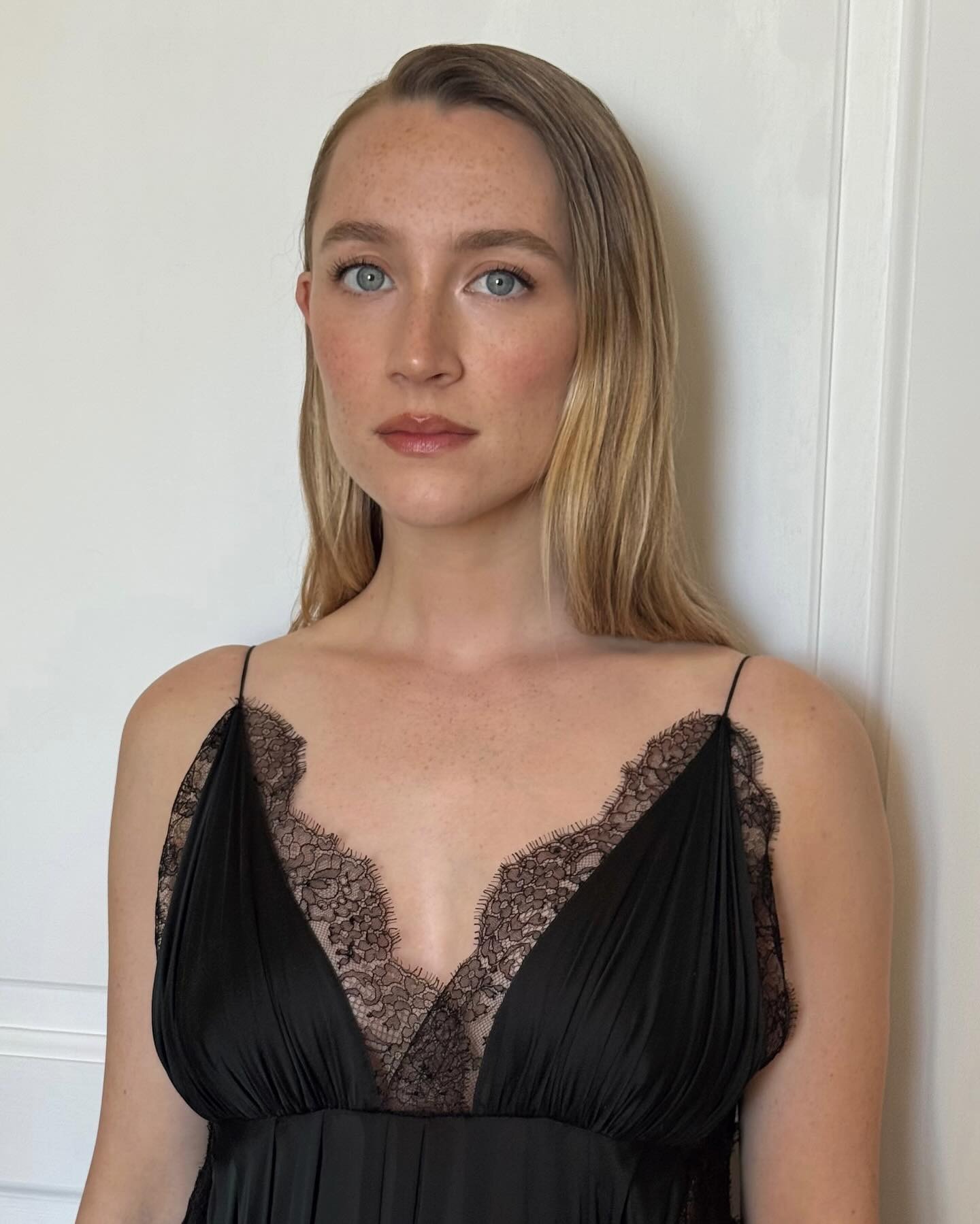 Saoirse Ronan with a wet-look, side part hairstyle