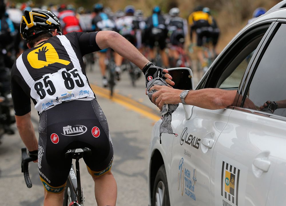 Matthew Goss of MTN-Qhubeka collect rain gear from his team car during the climb of Balcom Canyon Road during stage five of the 2015 Amgen Tour of California