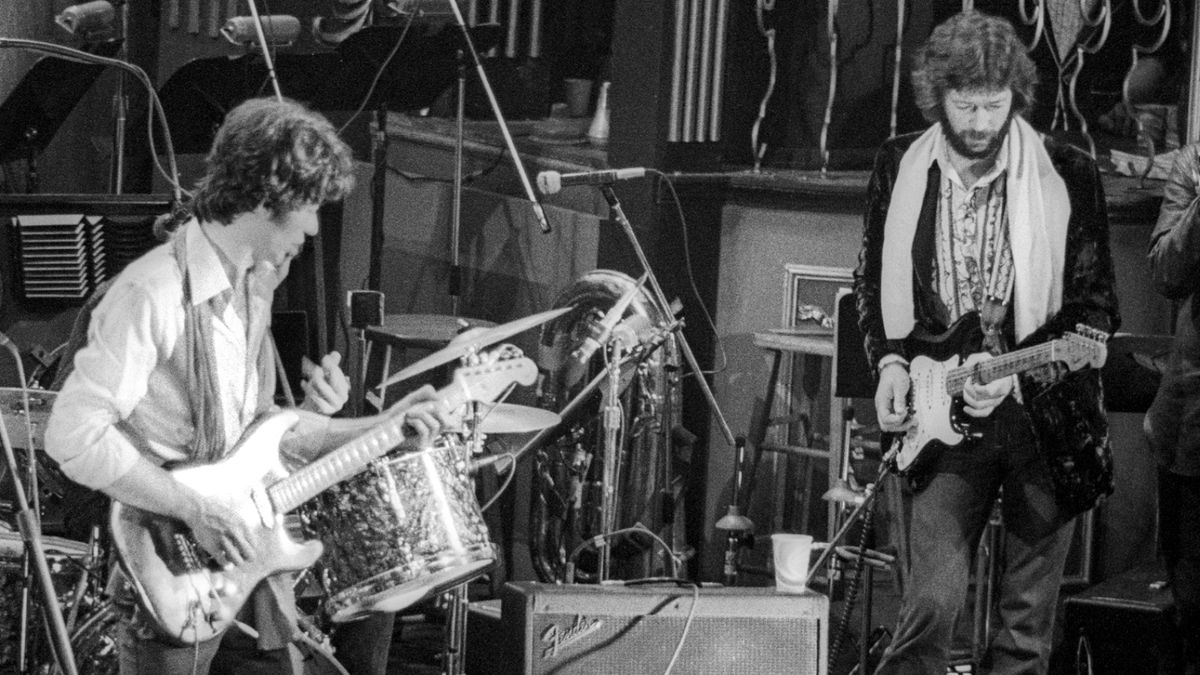 Robbie Robertson (left) and Eric Clapton perform during The Last Waltz at Winterland on November 25, 1976 in San Francisco, California.