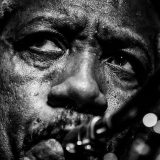 A black and white close up of jazz saxophonist Billy Harper