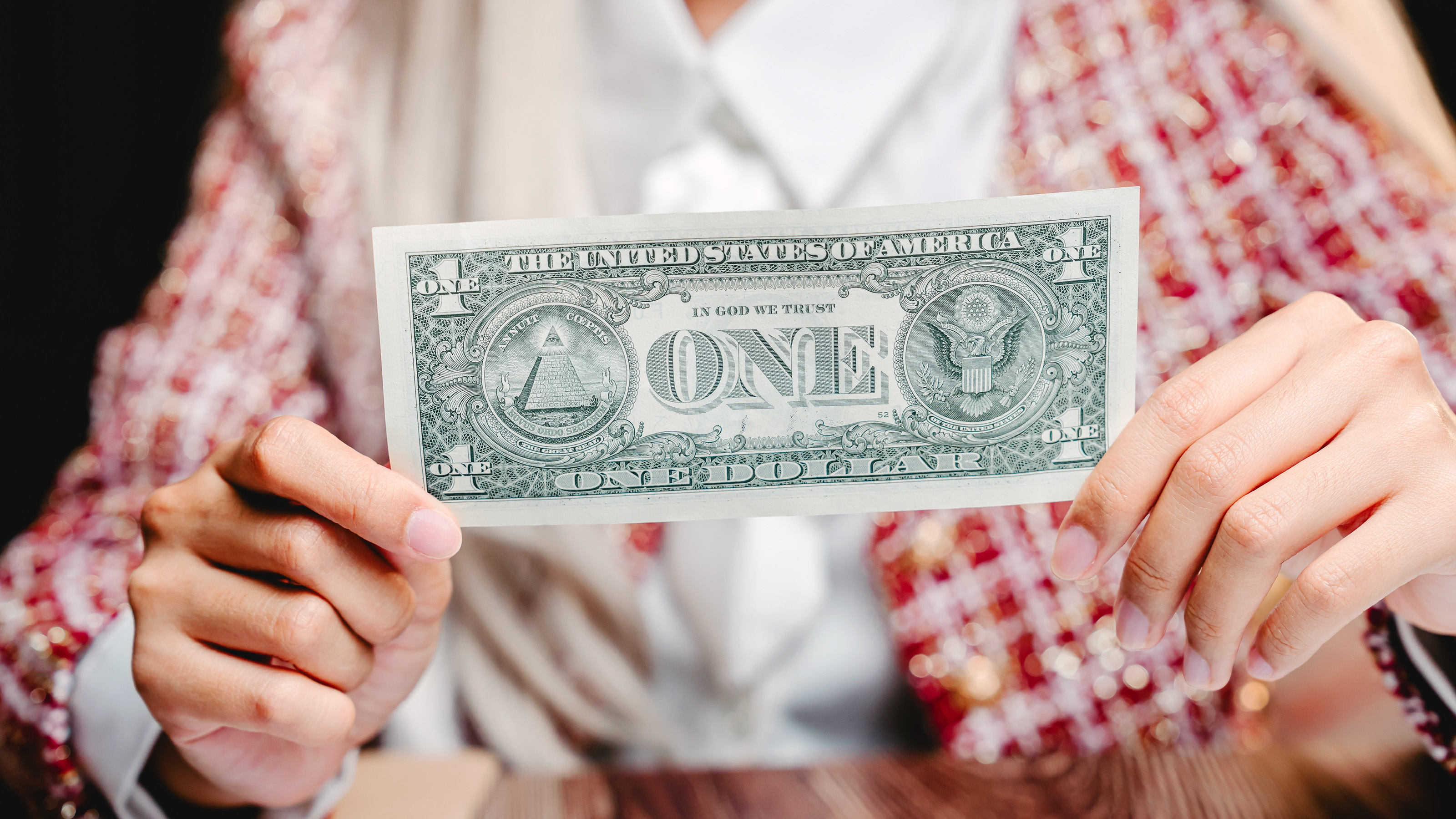 hand holding dollar bill