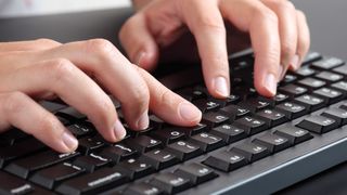 Hands closeup of person typing - securing coding training
