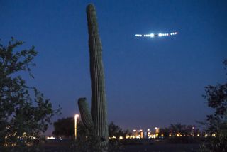 The Solar Impulse plane departs Phoenix, Arizona on May 22, 2013, on the second leg of its cross-country flight.