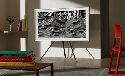 TV with a white frame and a geometrical image on the screen, in a living room setting